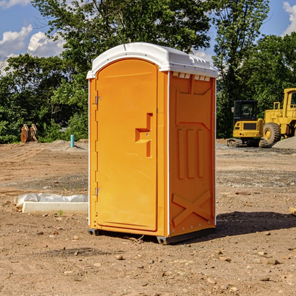 what is the cost difference between standard and deluxe portable restroom rentals in Bay Mills